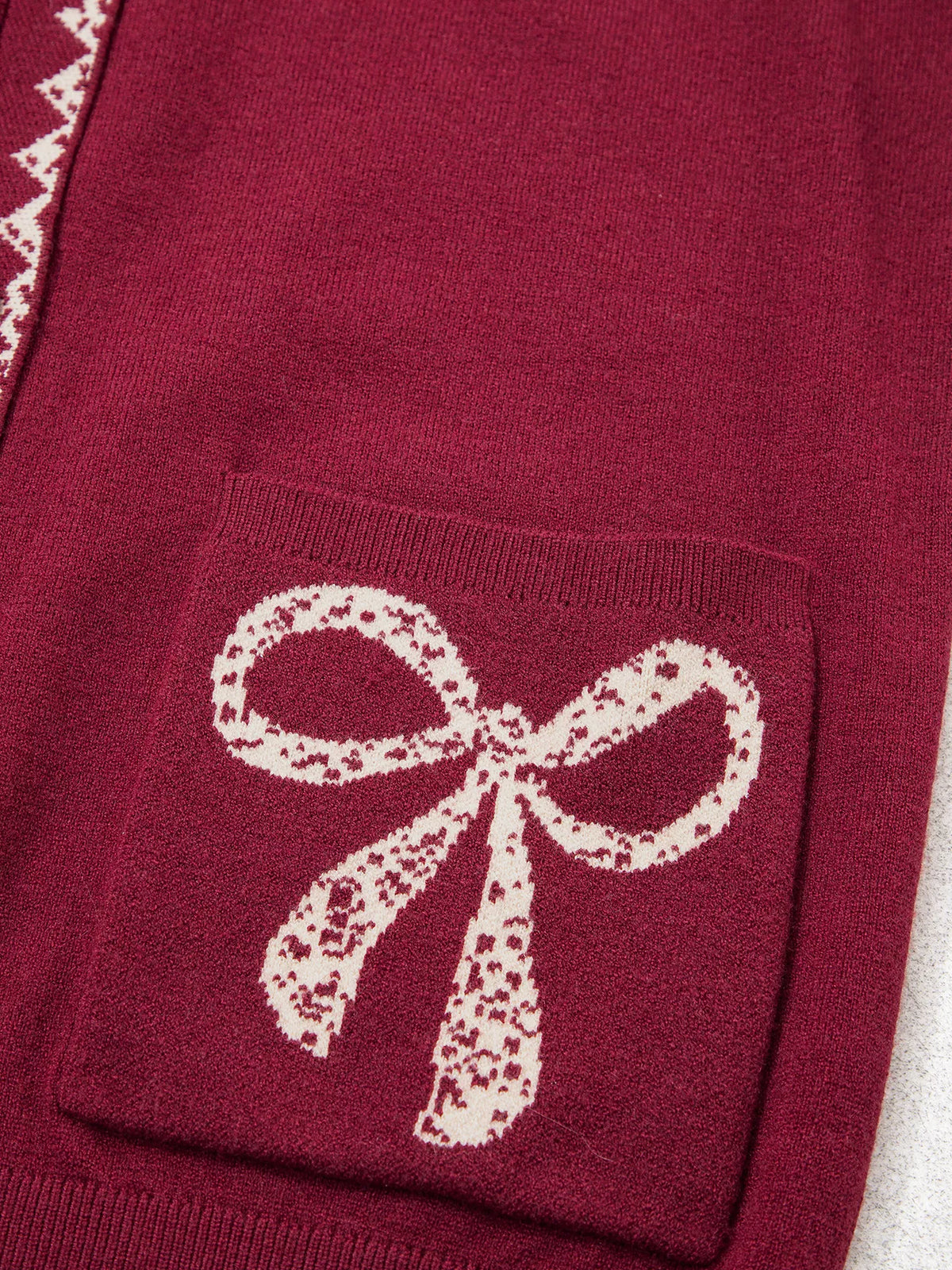 Mona cardigan med rosett